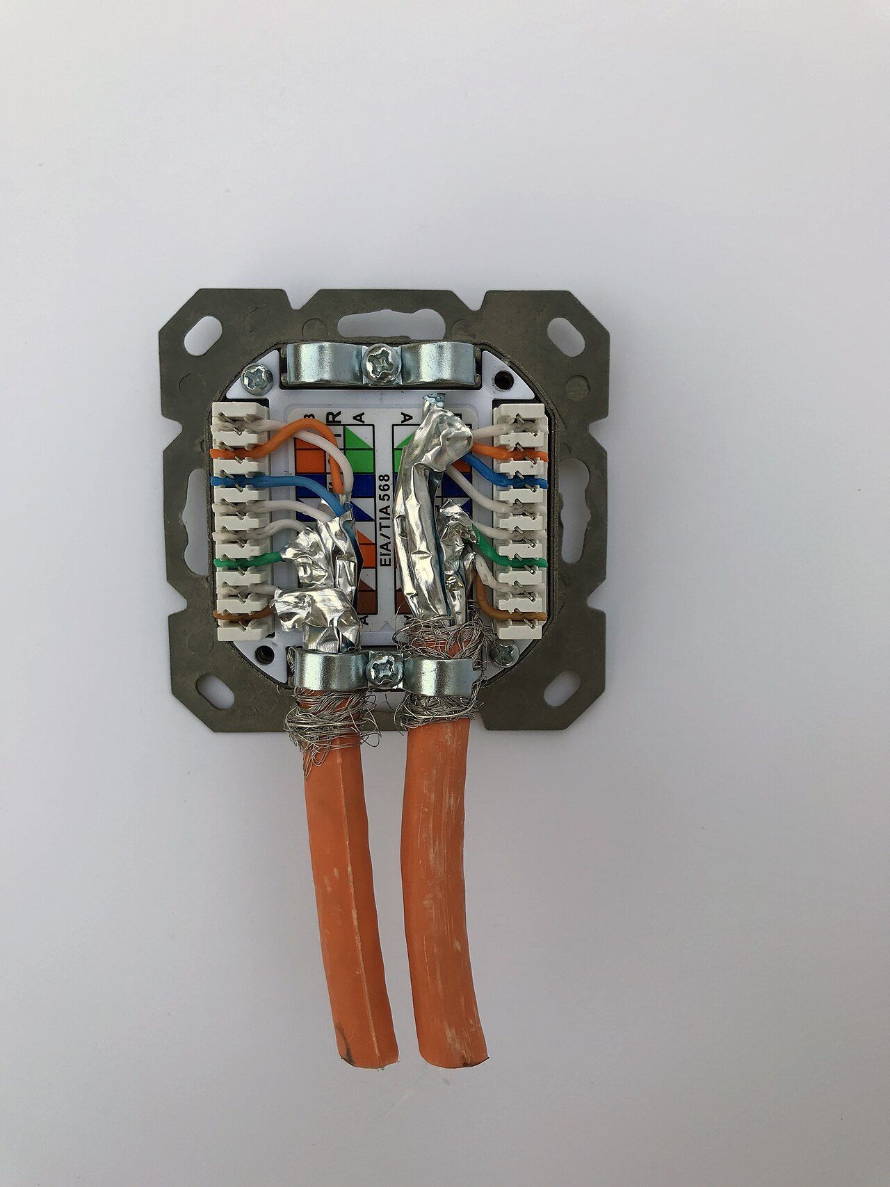 A clean network wall socket with cables seated, representing reliable daily connectivity